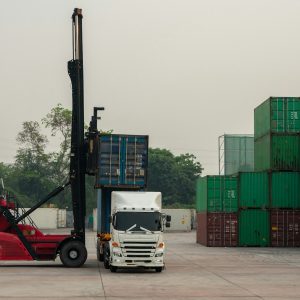 Forklift Truck loading Container to Cargo Truck Forklift working in the container cargo yard port l